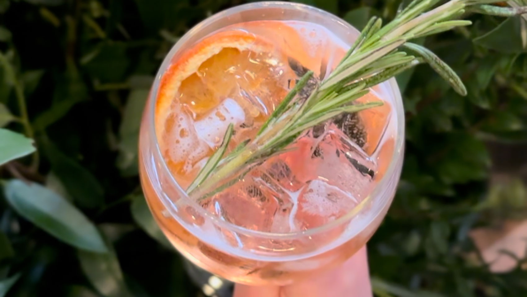 Cocktail with rosemary garnish